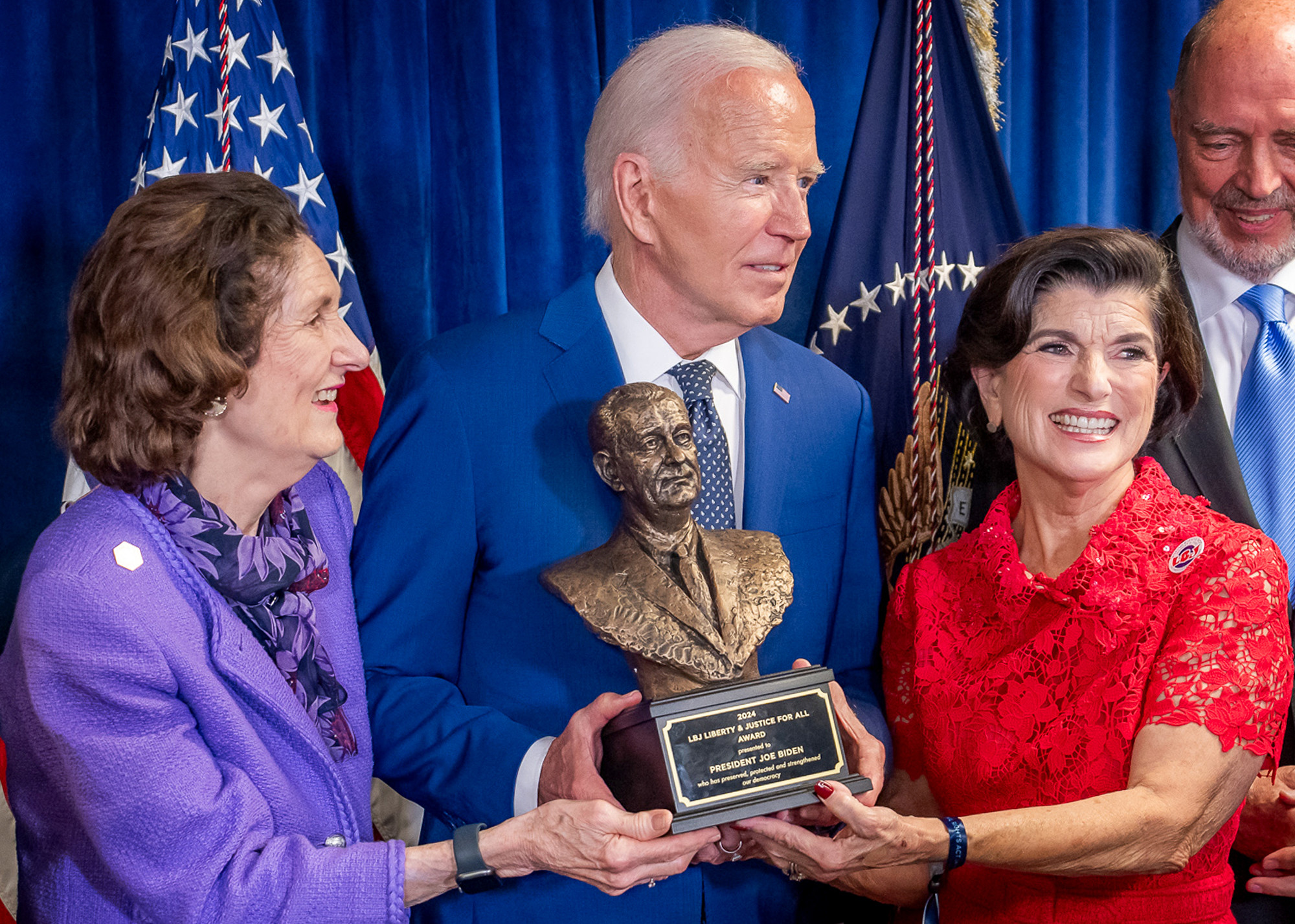 Lynda Johnson Robb, left, and Luci Baines Johnson present President Joe Biden with the LBJ Liberty & Justice for All Award on Monday, July 29, 2024, before an event celebrating the 60th Anniversary of the Civil Rights Act at the LBJ Library in Austin, Texas. Official White House Photo by Adam Schultz